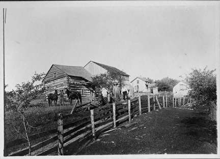 Log House with Split Rail Fence for Early Settlers and Horses
